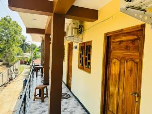 an open door of a house with a balcony at Shan guest rooms in Jaffna