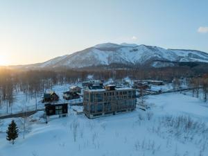 an aerial view of a building in the snow at The 1898 Niseko in Kutchan