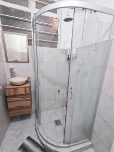 a shower stall in a bathroom with a sink at Cozy Apartamento en Puebla! in San Baltasar