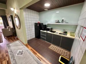 a small kitchen with a sink and a counter at The Regency PortDickson A1-7 in Port Dickson