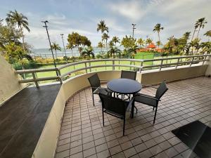 a patio with a table and chairs on a balcony at The Regency PortDickson A1-7 in Port Dickson