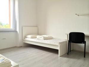 Postelja oz. postelje v sobi nastanitve Apartments Šik 2
