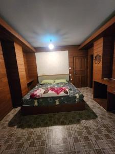a bedroom with a large bed in a room at Little Bro Mae Hong Son in Ban Mai +7 photos
