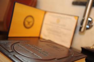 a chocolate bar sitting on top of a wooden table at Millenium Palace in Ohrid