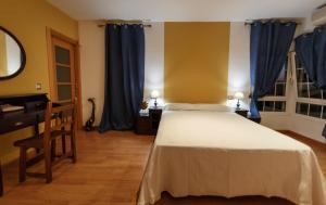 Postel nebo postele na pokoji v ubytování Casa Rural La Piedra De Juana + 37 fotografií