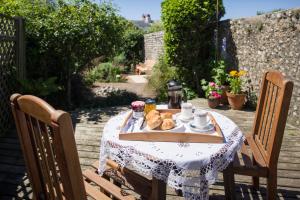 a table with a plate of food on it at Lamb's Knees in Seaford