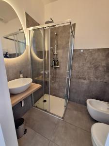 a bathroom with a shower and a sink and a toilet at Affittacamere La Polse in Osoppo +45 photos