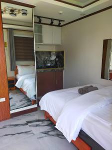Postelja oz. postelje v sobi nastanitve Kabayan's Hotel