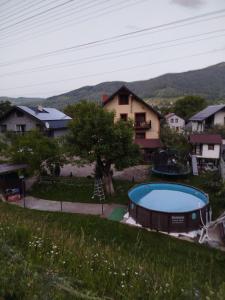 a house with a swimming pool in a yard at Gorec in Yaremche