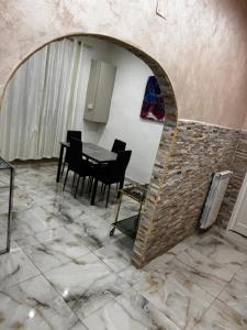 a dining room with a table and chairs at Casa Rosa in Monterotondo +13 photos