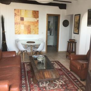 a living room with a couch and a table at Apartment Rincón in Mojácar