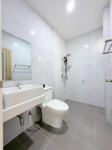 a white bathroom with a toilet and a sink at Ban Belife14 in Ban Tha Chin (1) +5 photos
