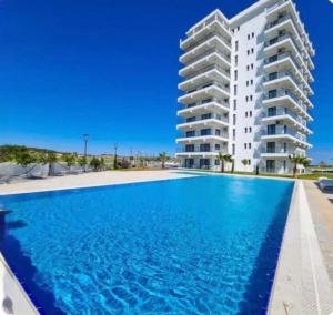 a large swimming pool in front of a building at Helena Resort & Spa in Kalecik