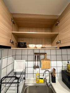 a kitchen with a sink and a counter top at Homiq Stays near UN & Village Market - 1 bedroom in Ruaka