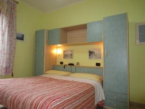 Postel nebo postele na pokoji v ubytování Albergo Primavera