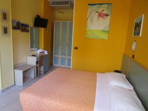 Postel nebo postele na pokoji v ubytování Albergo Primavera