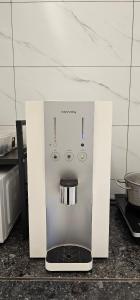 a small appliance sitting on a counter in a kitchen at Casa for 8 ipoh Central Pet Allowed in Ipoh