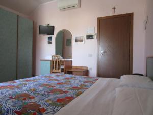 Postel nebo postele na pokoji v ubytování Albergo Primavera