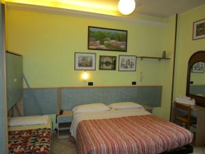 Postel nebo postele na pokoji v ubytování Albergo Primavera
