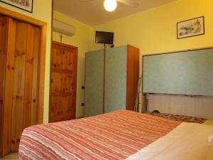 Postel nebo postele na pokoji v ubytování Albergo Primavera