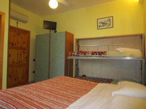 Postel nebo postele na pokoji v ubytování Albergo Primavera