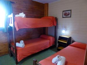 A bunk bed or bunk beds in a room at Hotel Hualum