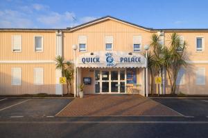 a building with a quik and pirate sign on it at Quick Palace Saint Brieuc in Tregueux