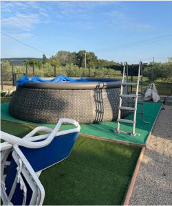 a swing set with a ladder on a playground at Studio décoré avec goût in Saint-Paul-Trois-Châteaux +2 photos