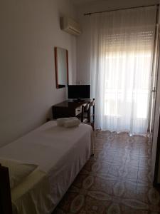 Postel nebo postele na pokoji v ubytování Albergo Europa