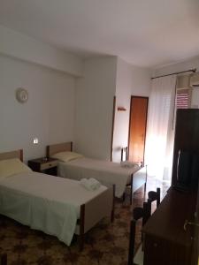 Postel nebo postele na pokoji v ubytování Albergo Europa