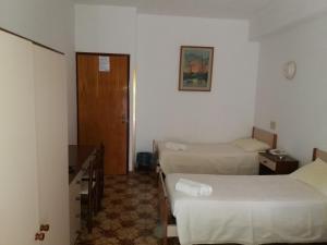 Postel nebo postele na pokoji v ubytování Albergo Europa