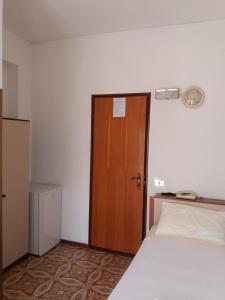 Postel nebo postele na pokoji v ubytování Albergo Europa