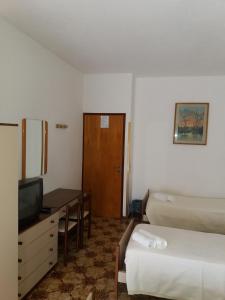 Postel nebo postele na pokoji v ubytování Albergo Europa