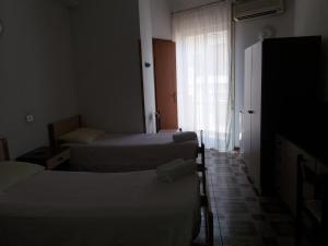 Postel nebo postele na pokoji v ubytování Albergo Europa