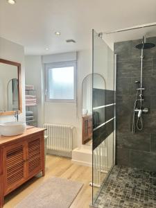 a bathroom with a sink and a glass shower at Maison Les Sardines in Cucq +19 photos