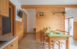 a kitchen and dining room with a table and chairs at Il Nido di Somadino in Casargo