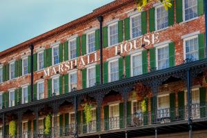 a sign on the side of a building at The Marshall House, Historic Inns of Savannah Collection in Savannah