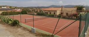 a tennis court on top of a house at Zeeva Hotel and Resort in Torre Dei Corsari