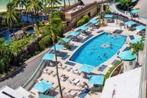 an overhead view of a pool at a resort at #Marbella Lane - Luxe 2BR with Panoramic Ocean View in Honolulu