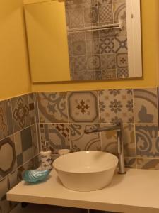 a bathroom with a sink and a mirror at Mare&Sorrisi in Porto San Giorgio
