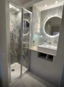 a bathroom with a shower and a sink and a mirror at Le Regioni Del Cuore in Vieste +19 photos