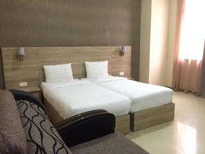 Letto o letti in una camera di Primer Hotel