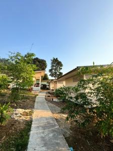 a walkway in front of a house at O Zen Resort in Ko Man Nai +9 photos