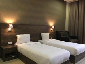 Letto o letti in una camera di Primer Hotel