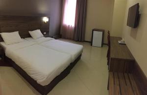Letto o letti in una camera di Primer Hotel