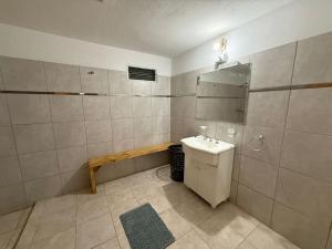a bathroom with a sink and a mirror at Refugio del Alma in Villa Anizacate +34 photos