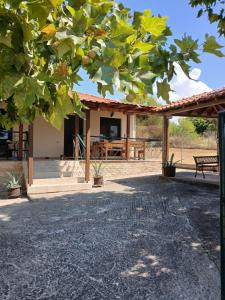 a view of a house with a patio at Lefter's Cottege in Nea Irakleia