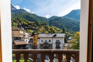 a view from a balcony of a town in the mountains at HelloCHALET - Casa Val - Your Walking Distance holiday in Valtournenche
