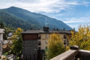 a view of a building with a mountain in the background at HelloCHALET - Casa Val - Your Walking Distance holiday in Valtournenche