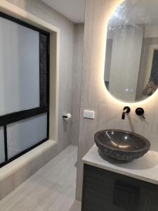 a bathroom with a sink and a mirror at Maisie Haven in Brisbane +37 photos